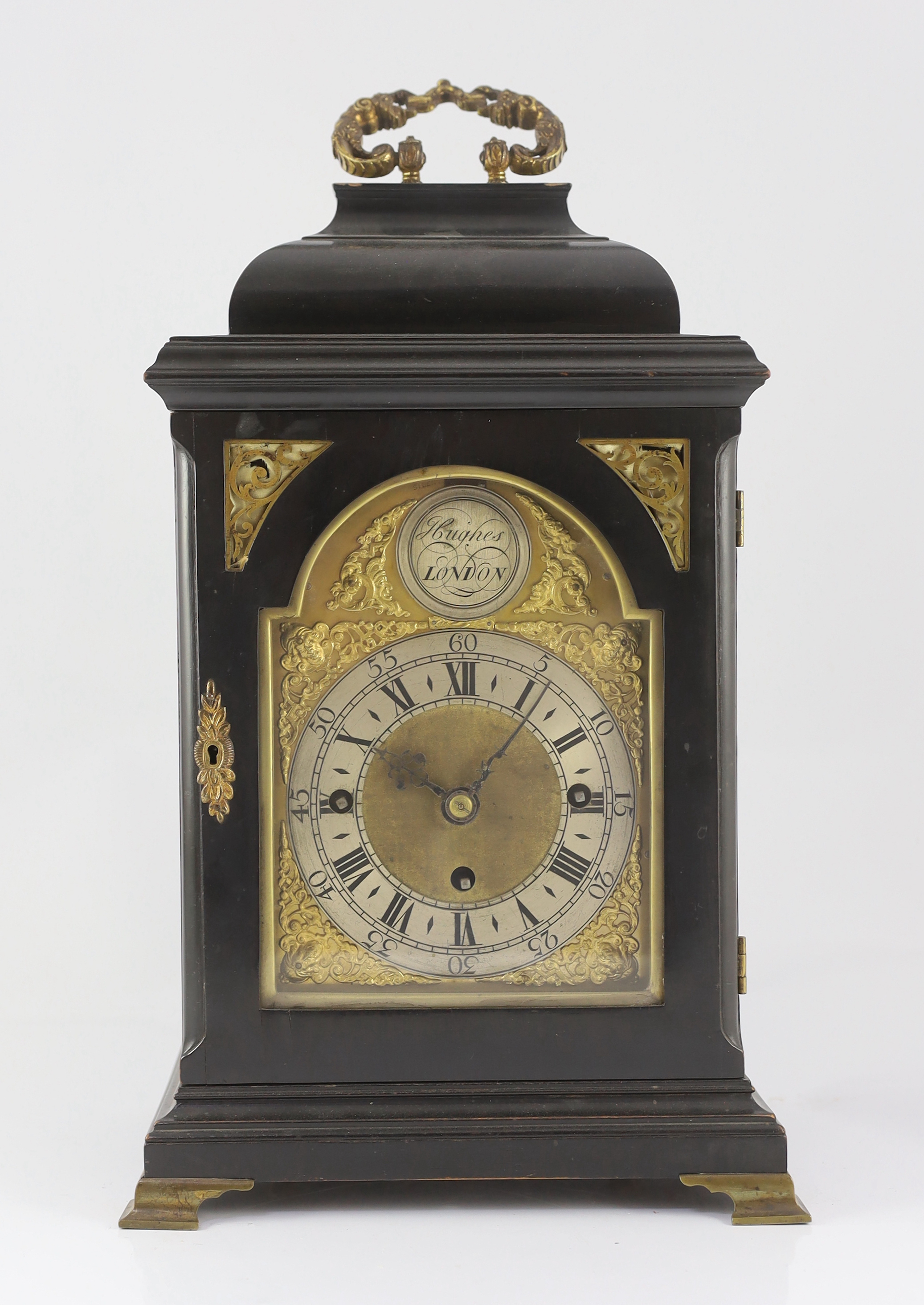 Hughes of London. A 19th century ebonised chiming bracket clock